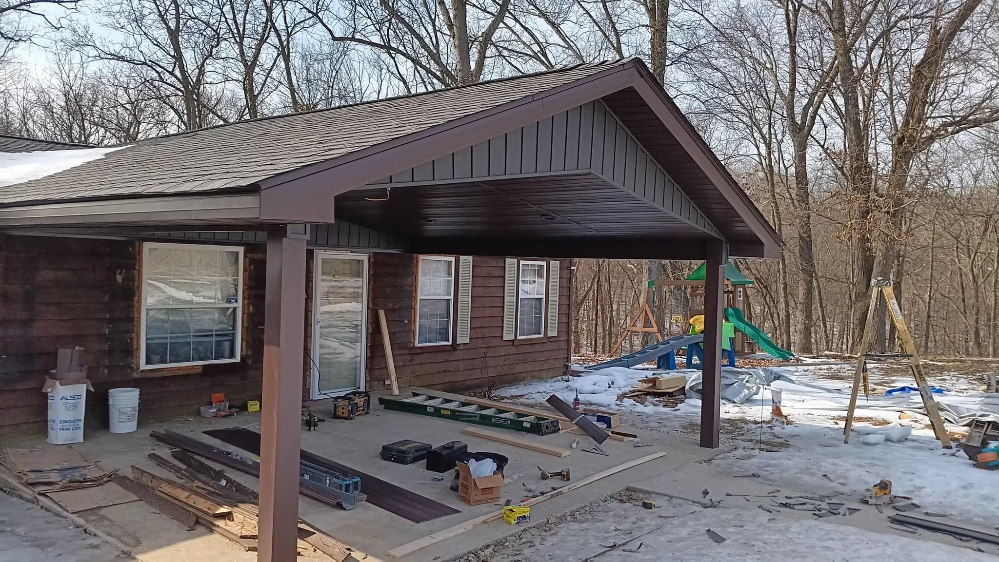 Covered porch addition with metal roofing