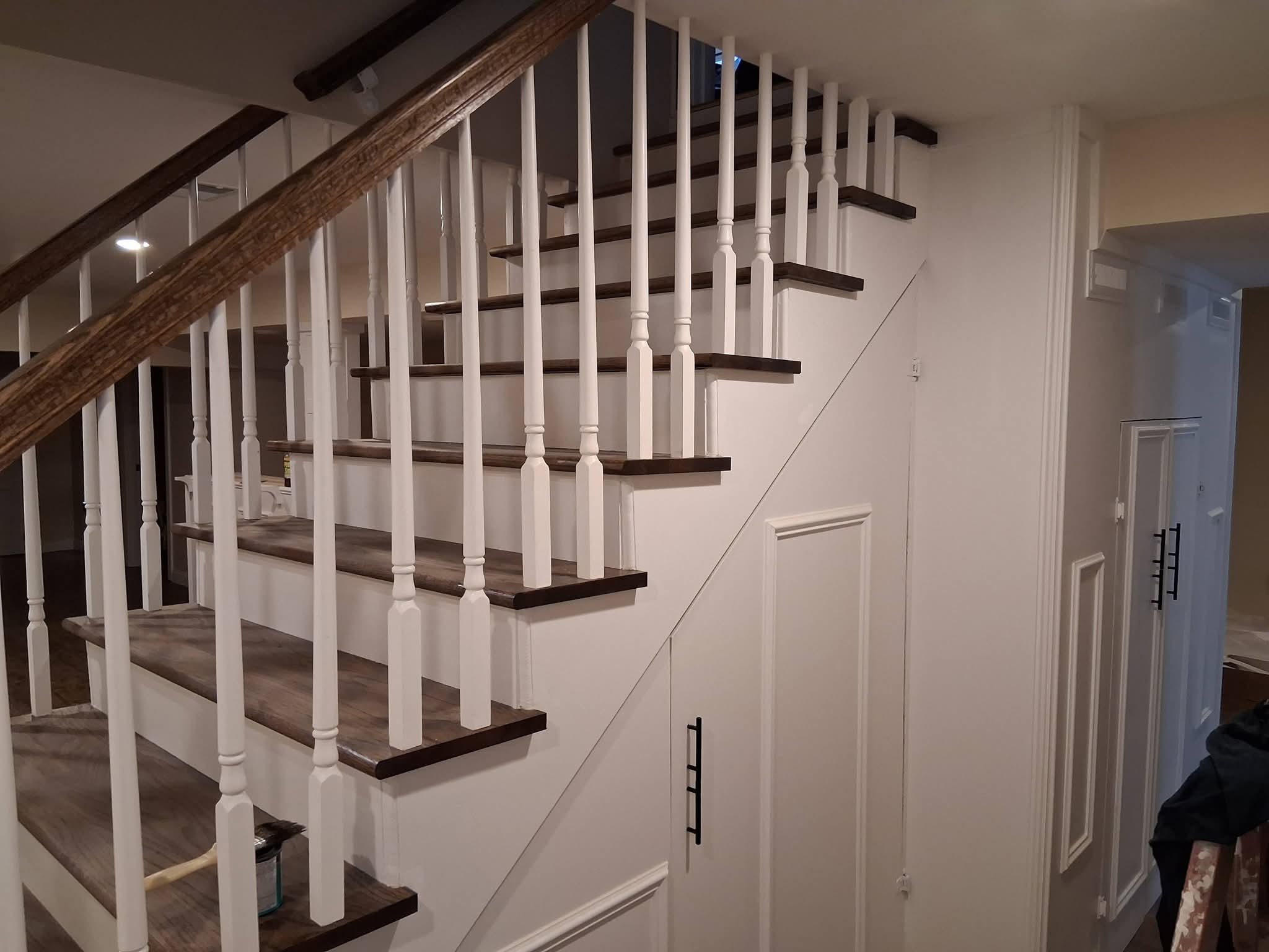 Custom staircase with stained wood treads and white balusters